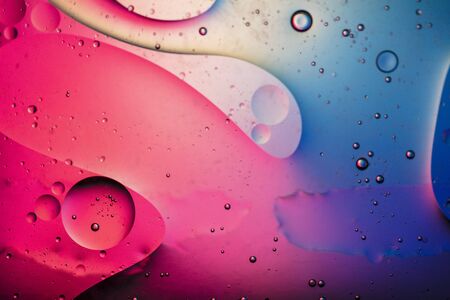Abstract colourful creative macro oil and water background with bubbles.