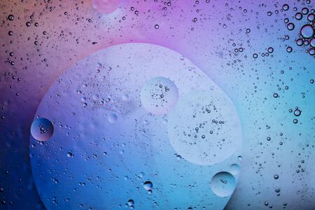 Abstract colourful creative macro oil and water background with bubbles.