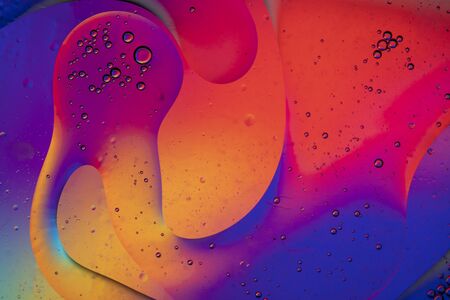 Abstract colourful creative macro oil and water background with bubbles.