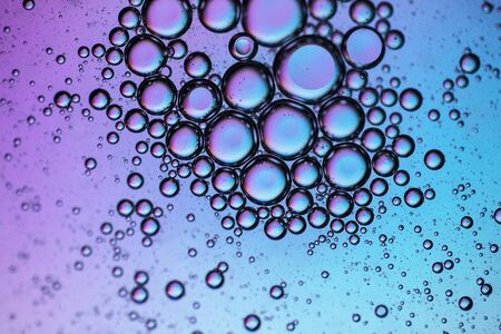 Abstract colourful creative macro oil and water background with bubbles.