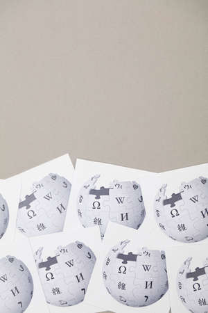 OXFORD, UK - FEB 16 2017: Wikipedia online encyclopedia logo printed on paper