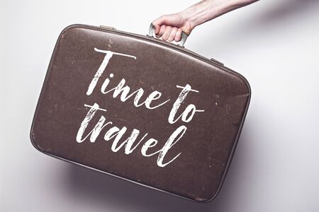 Time to travel to travel message on a vintage travel suitcaseの写真素材
