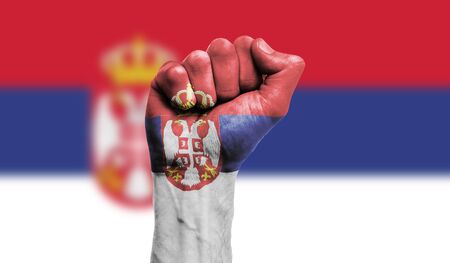 Serbia flag painted on a clenched fist. Strength, Protest conceptの写真素材