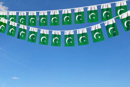 Pakistan flag festive bunting hanging against a blue sky. 3D Renderの写真素材