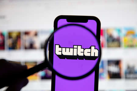 LONDON, UK - April 30 2020: Twitch live gaming logo under a magnifying glassのeditorial素材