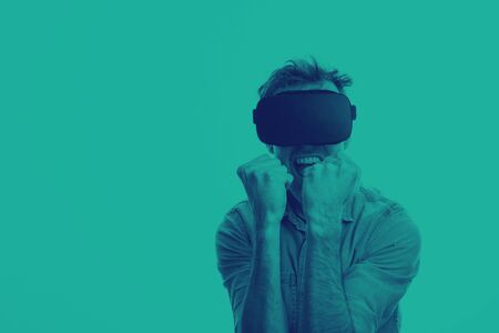 Man in his 30s wearing a VR virtual reality headset. Graphic duotone style