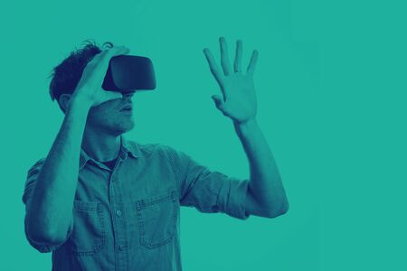 Man in his 30's wearing a VR virtual reality headset. Graphic duotone style