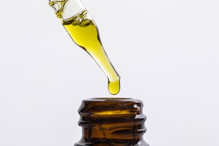 Close up of CBD oil in a dropper bottleの写真素材