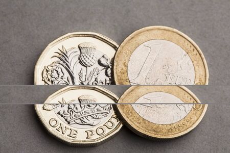 British one pound coin and one euro coin. Exchange rate concept