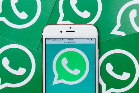 LONDON, UK - MARCH 2017: WhatsApp social messaging app logo on a smartphone.のeditorial素材