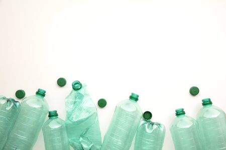 Empty green plastic waste water bottles ready to be recycled.の写真素材