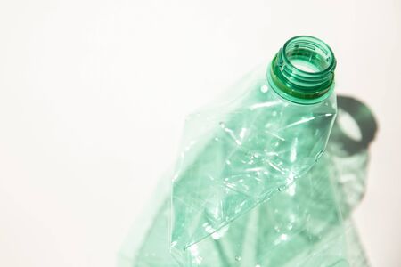 Empty green plastic waste water bottle ready to be recycled.の写真素材