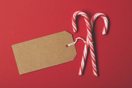 Festive Christmas candy cane with a blank gift tag