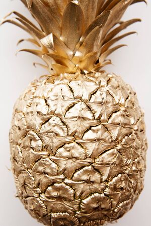 trendy tropical gold pineapple on a plain white background top viewの写真素材