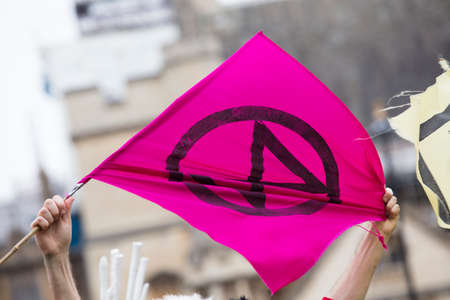 Extinction Rebellion flags being waved at a protest in Londonのeditorial素材