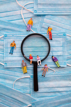 Covid health investigation. People on a mask and magnifying glass