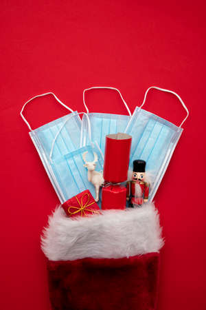 Christmas stocking with covid-19 face mask and gifts