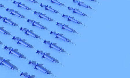 Rows of vaccination syringes lined up on a blue background. 3D Renderingの写真素材