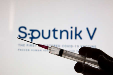 OXFORD, UK - February 2020: Sputnik V covid vaccine logo with injection syringeのeditorial素材