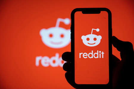 LONDON, UK - February 2021: Reddit logo displayed on a smartphone deviceのeditorial素材