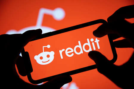 LONDON, UK - February 2021: Reddit logo displayed on a smartphone deviceのeditorial素材
