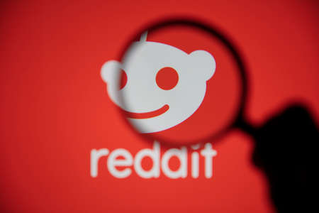 LONDON, UK - February 2021: Reddit logo seen under a magnifying glassのeditorial素材