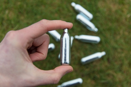 Nitrous oxide metal bulbs or laughing gas recreational drug useの写真素材