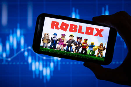 LONDON, UK - March 2021: Roblox game logo in front of stock market chartのeditorial素材