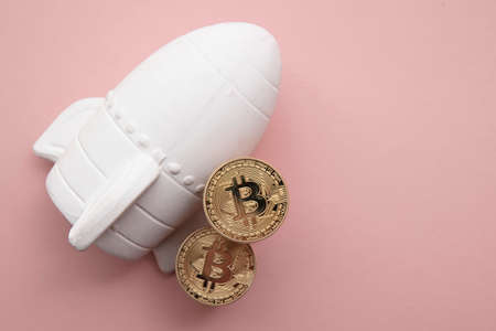 space rocket with Bitcoin cryptocurrency. financial investment increase