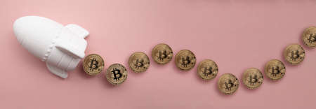 space rocket with Bitcoin cryptocurrency. financial investment increase