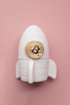 space rocket with Bitcoin cryptocurrency. financial investment increase