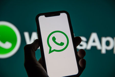 LONDON, UK - March 2021: Whatsapp online messaging service logo on a smartphoneのeditorial素材