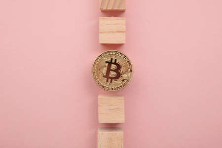 Bitcoin cryptocurrency coin blockchain technology concept. Coin with wood blockの写真素材