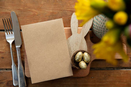 Easter celebration meal table layout with a blank menuの写真素材
