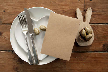 Happy easter celebration background. Decorated table with blank menu