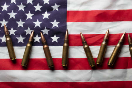 Bullet ammunition on a United states stars and stripes flag