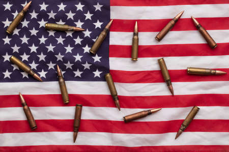 Bullet ammunition on a United states stars and stripes flagの写真素材