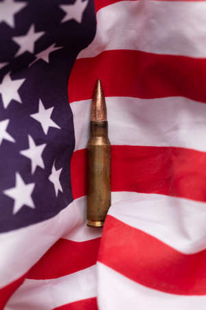 Bullet ammunition on a United states stars and stripes flag