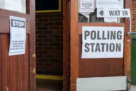 Polling station sign outside the entrance to a political voting location in UKの写真素材