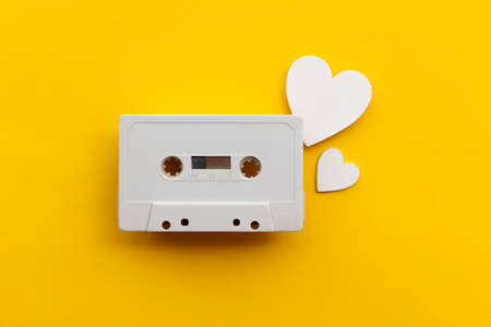 retro audio cassette tape surrounded by white love hearts