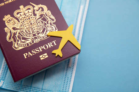 travel passport. Aeroplane on a passport with protective face maskの写真素材