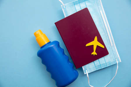 summer vacation background. Airplane on travel passport with maskの写真素材