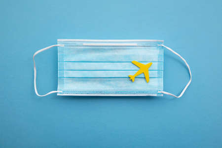 Toy airplane on a  protective face maskの写真素材