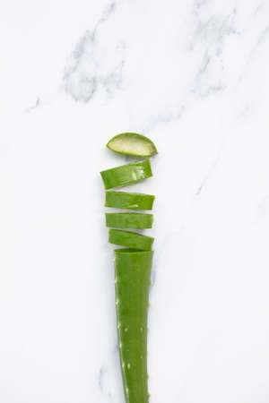 Natural green aloe vera stem cut into slices. Health and well being backgroundの写真素材