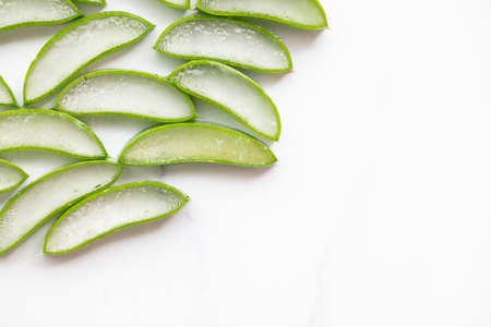 Natural green aloe vera stem cut into slices. Health and well being backgroundの写真素材