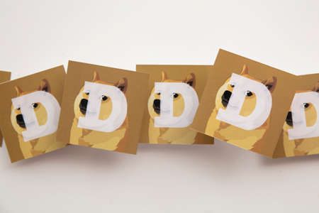 LONDON, UK - June 2021: Doge or dogecoin cryptocurrency logo on paperのeditorial素材