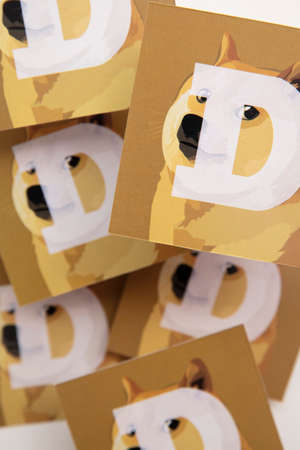 LONDON, UK - June 2021: Doge or dogecoin cryptocurrency logo on paperのeditorial素材