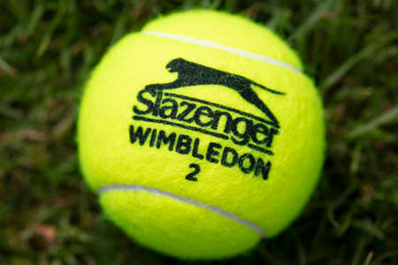 LONDON, UK - June 2021: Official wimbledon tennis Slazenger brand ball on grassのeditorial素材