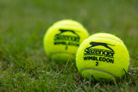 LONDON, UK - June 2021: Official wimbledon tennis Slazenger brand ball on grassのeditorial素材