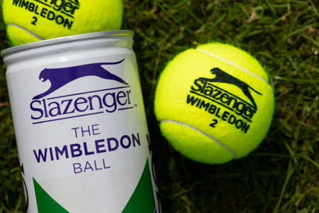LONDON, UK - June 2021: Official wimbledon tennis Slazenger brand ball on grassのeditorial素材